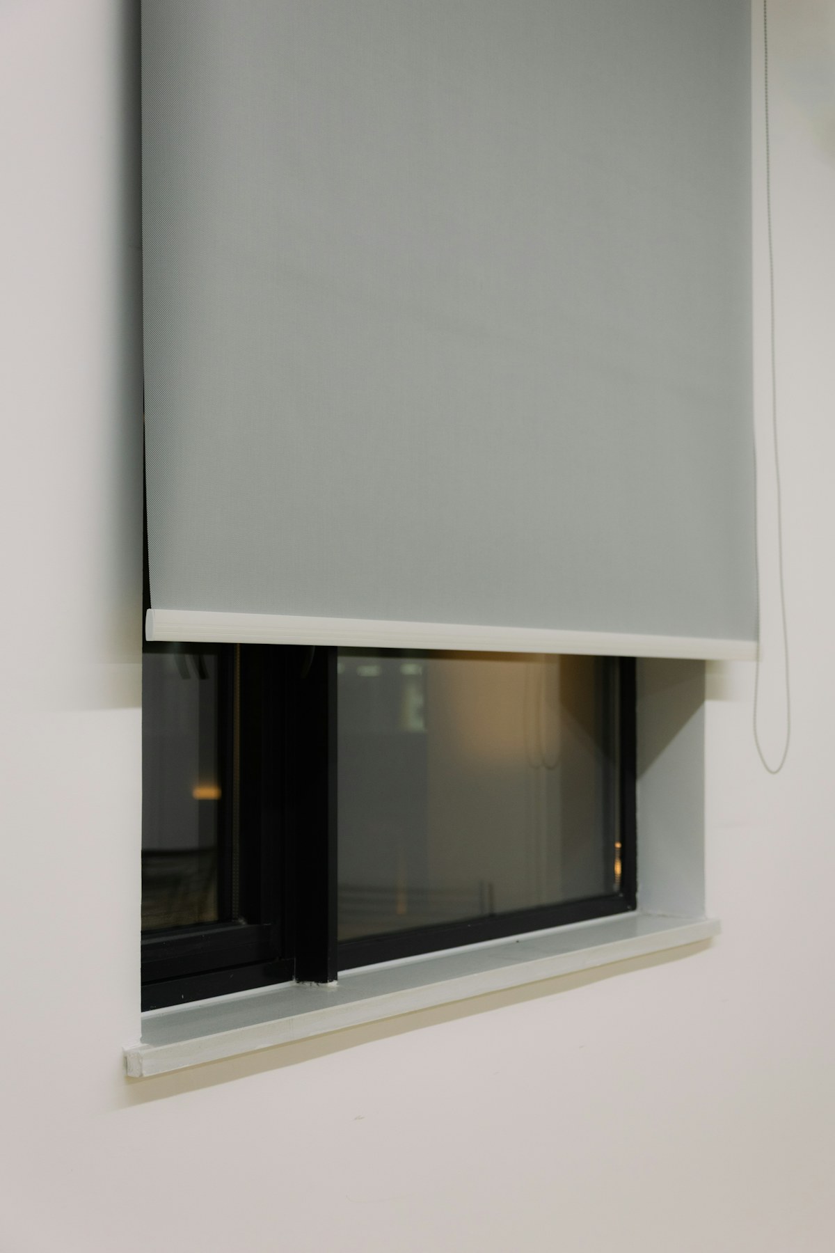 Contemporary grey roller blind suitable for compatible motorised systems