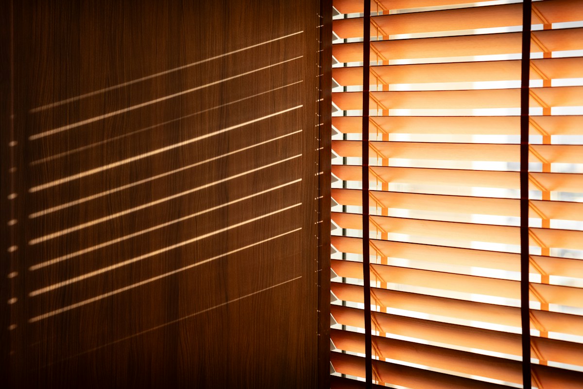 Real timber Venetian blinds with warm wooden slats